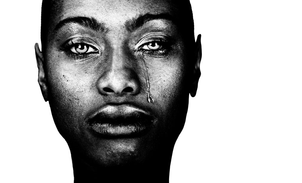A Striking Image of a Afro American Woman Crying